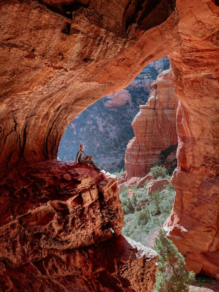 Sedona photographer and local adventure wedding creator in a Sedona cave