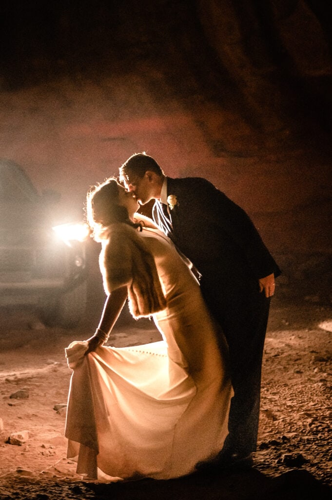 couple silhouetted in headlights during their Sedona elopement