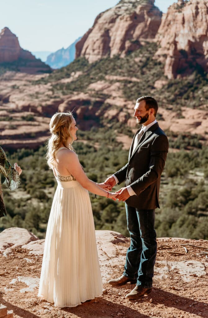 Happy couple holding hands during their Sedona elopement