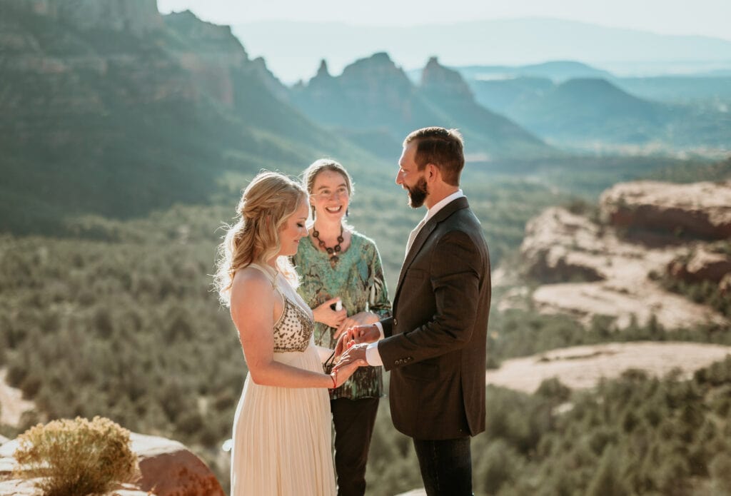 Officiant guiding elopement couple to begin their spiritual ceremony