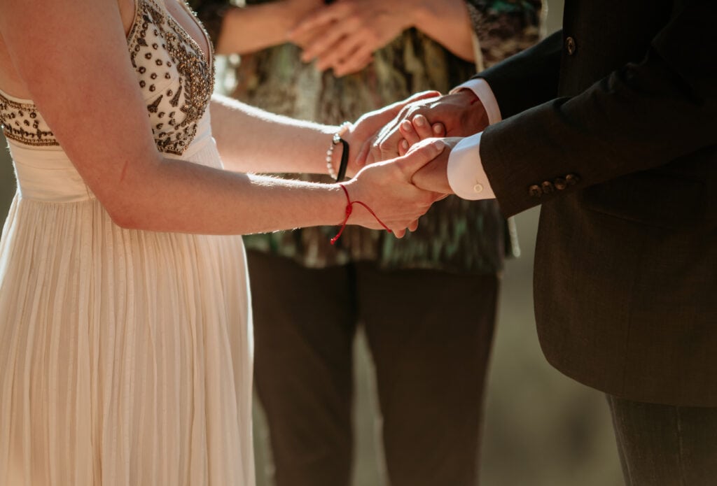 Couples hands clasped during their elopement ceremony