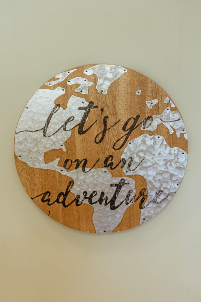 Let's go on an Adventure sign in vacation rental