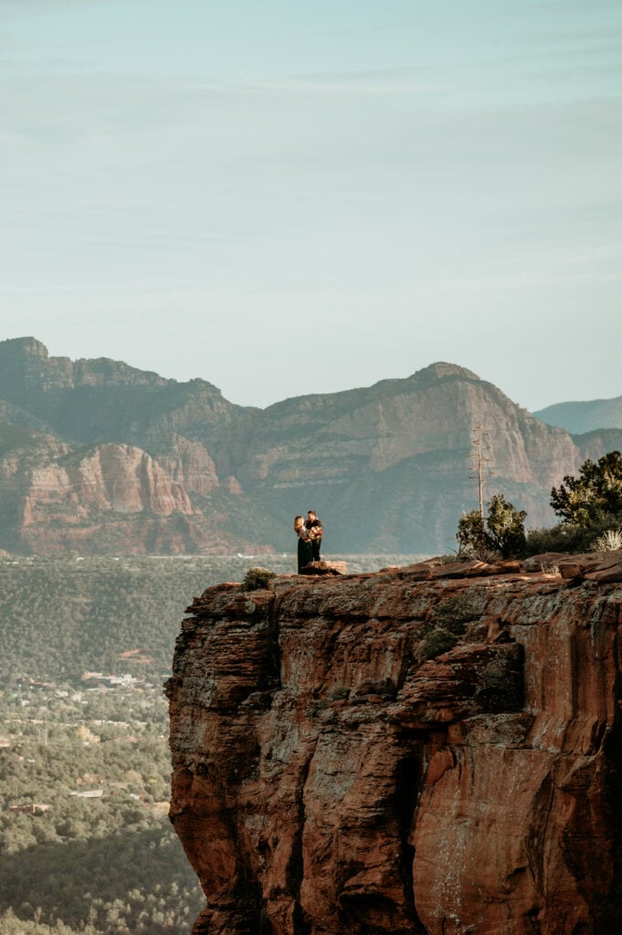 Eloping couple in Sedona on a red rock cliff