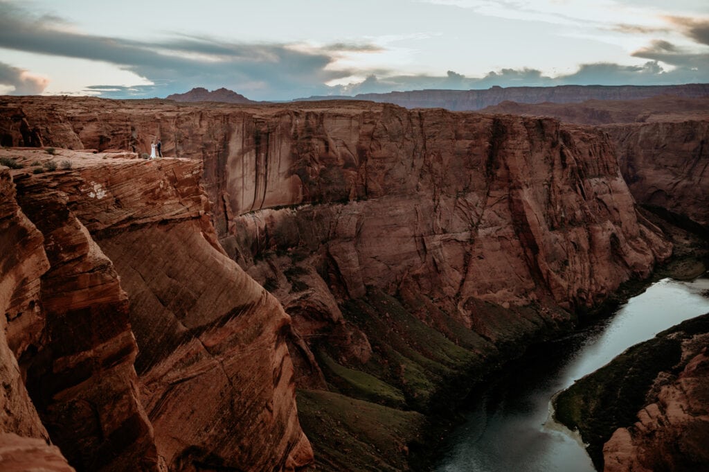 Couple saying their vows at the edge of Horseshoe Bend during their Page, Arizona elopement