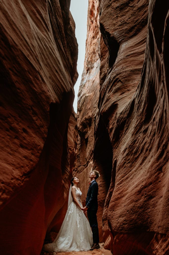 Adventurous couple in a slot canyon by Arizona Elopement Photographer Shannon Durazo from Stratus Adventure Photography