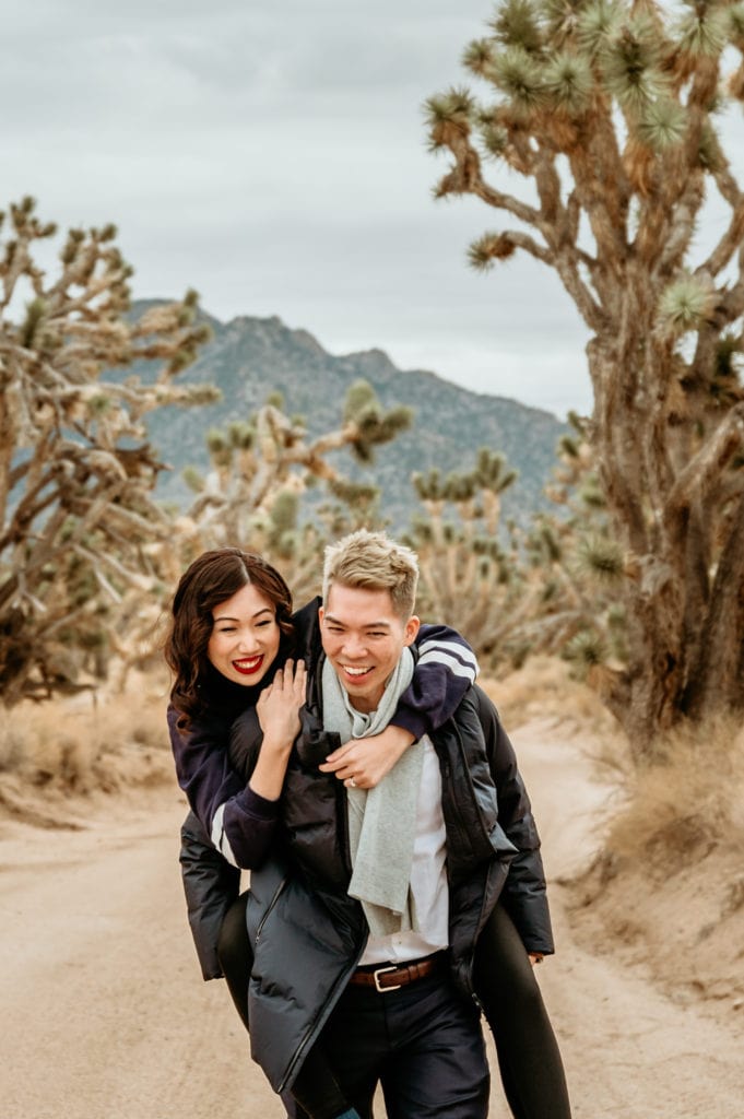 Couple laughing during their Joshua Tree Engagement photo session