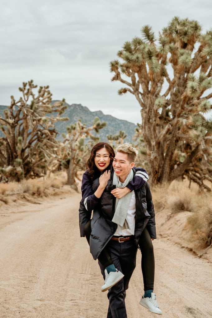 Piggy back ride surrounded by Joshua Trees