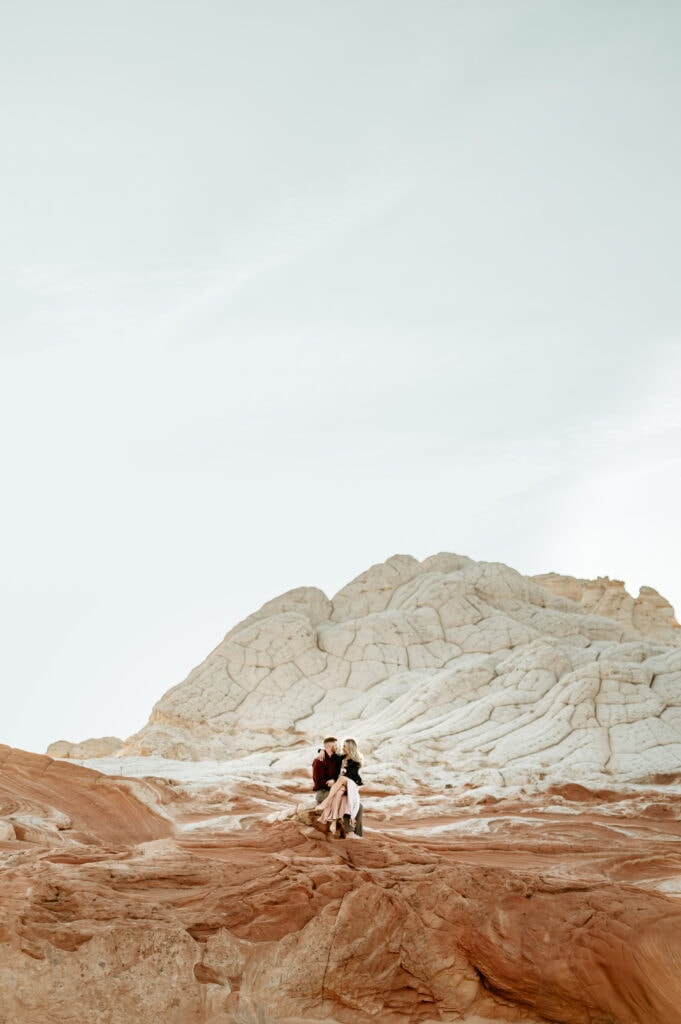Cassie and Nick snuggle up during their Vermillion Cliffs engagement Session