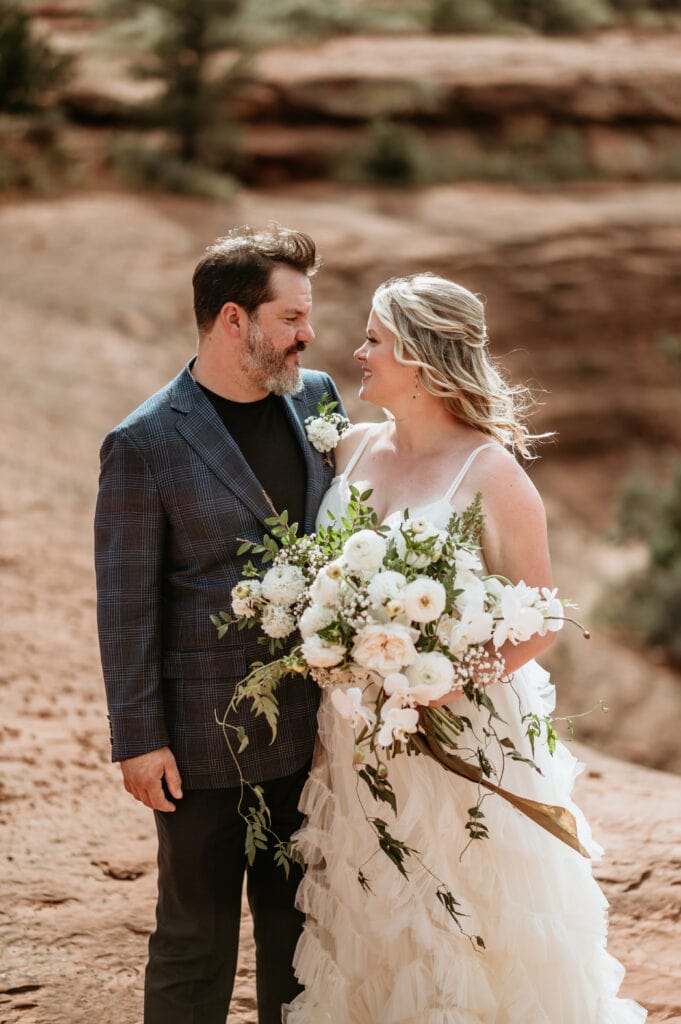 Bride and groom looking at each other during their elopement in Sedona AZ