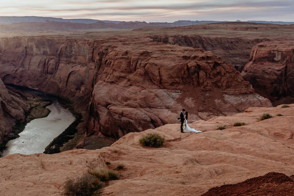 Wide shot of elopement couple at Horseshoe Bend in Arizona