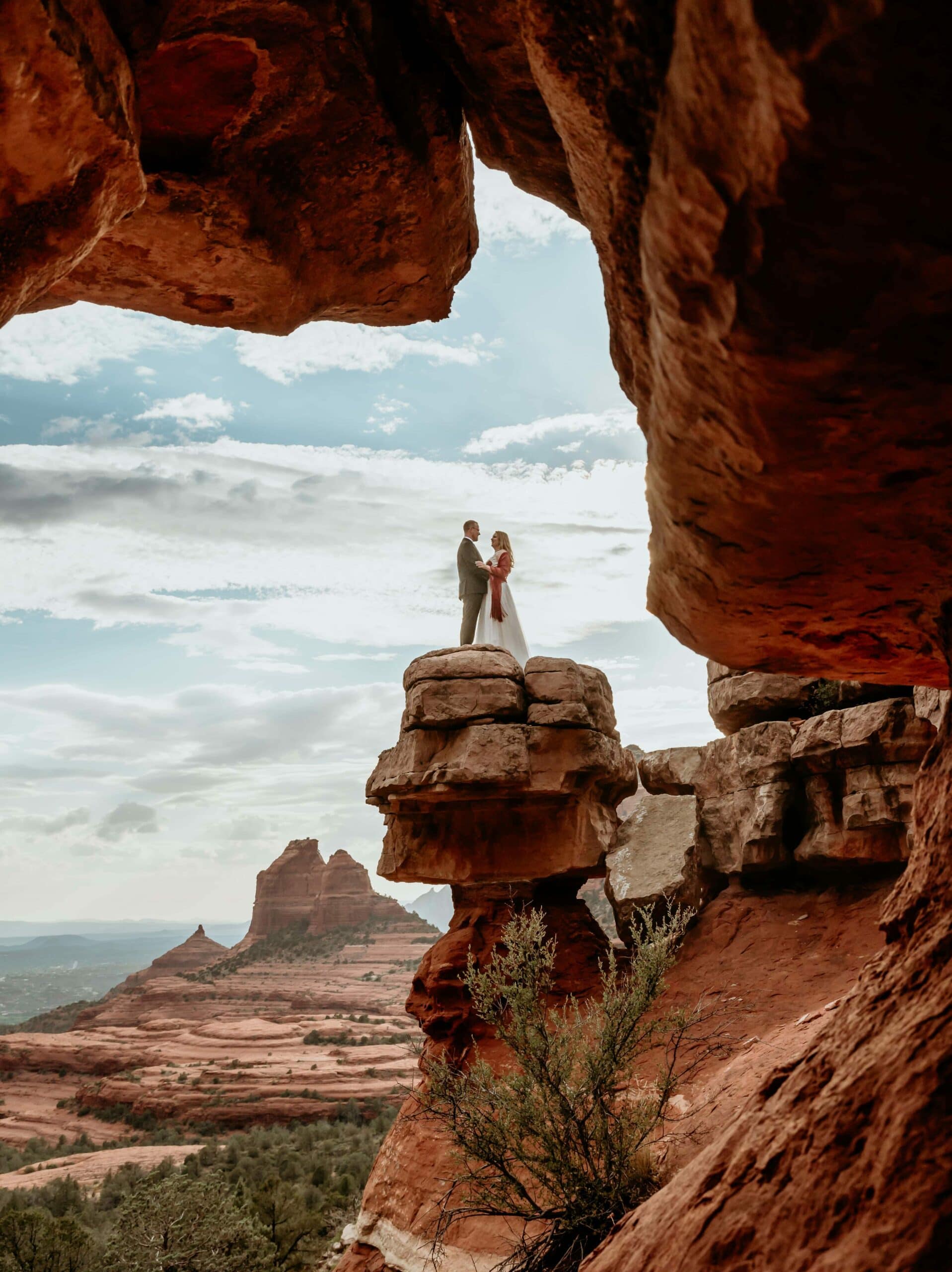 Sedona elopement wedding couple framed by red rocks