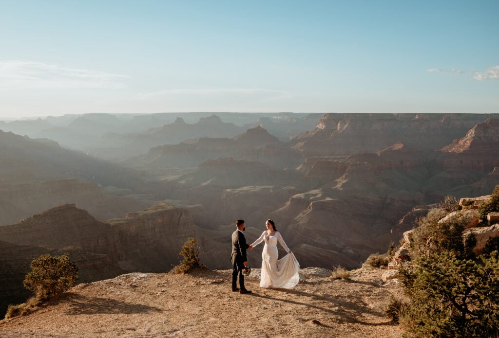 Couple dancing at the edge of the Grand Canyon during their elopement