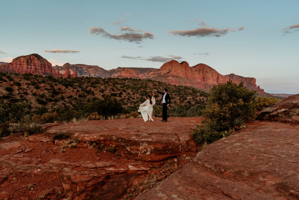 Couple dance on open flat space during blue hour at Cathedral Rock