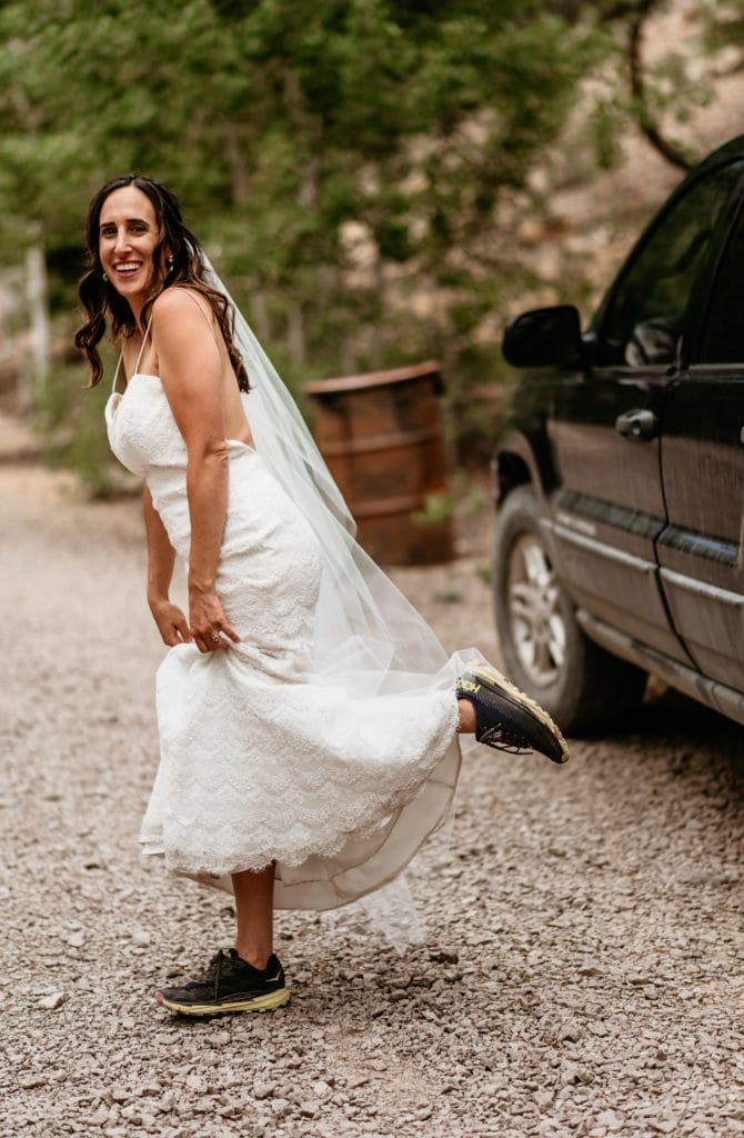 Bride being silly in her sneakers during Colorado elopement