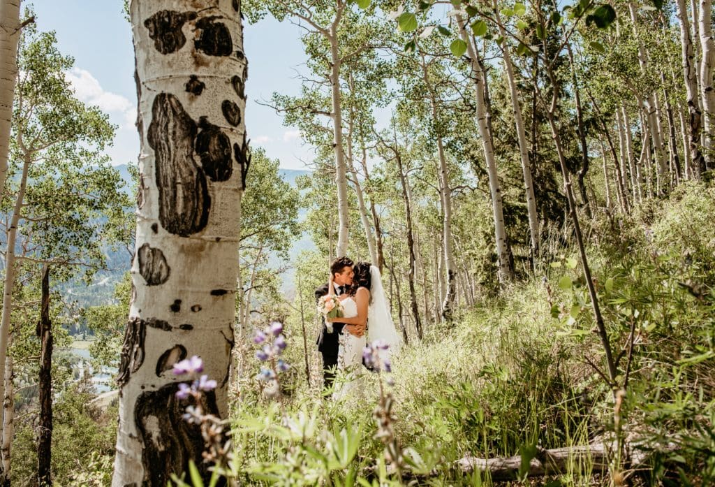 A kiss between the aspens during Colorado elopement