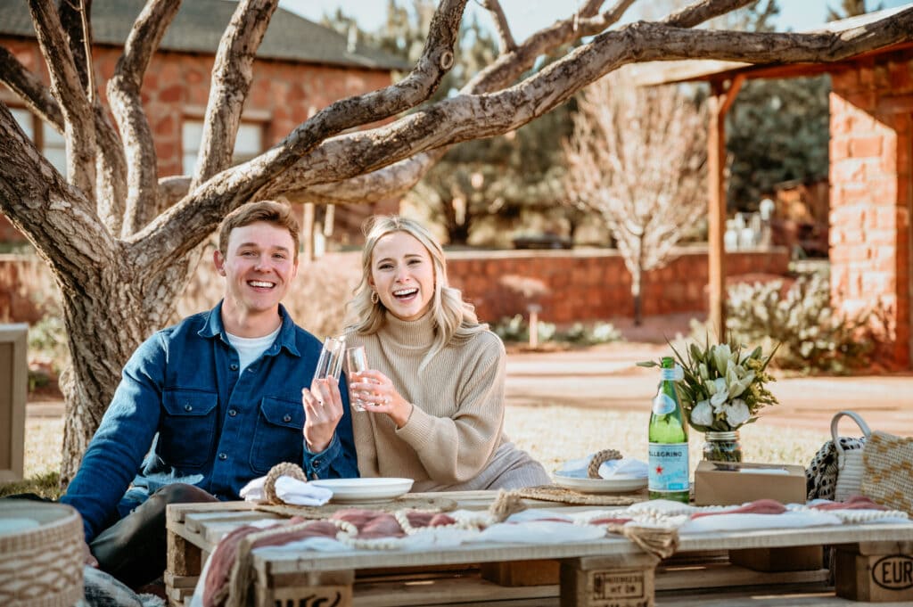Newly engaged couple celebrate with a private picnic setup in Sedona, Arizona
