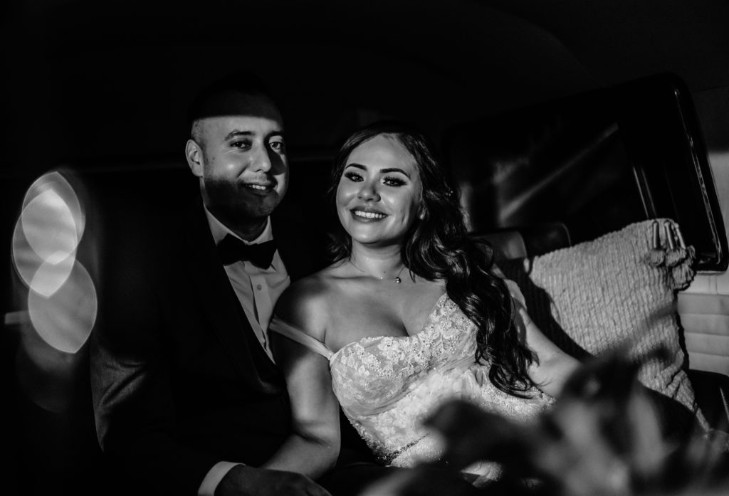 Bride and groom in photo bus