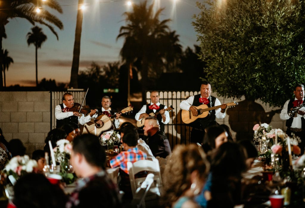 Backyard mariachi band wedding reception music as guest eat their dinner