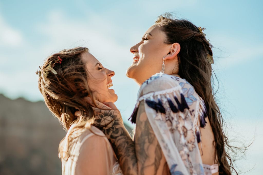 Brides laugh during Sedona elopement